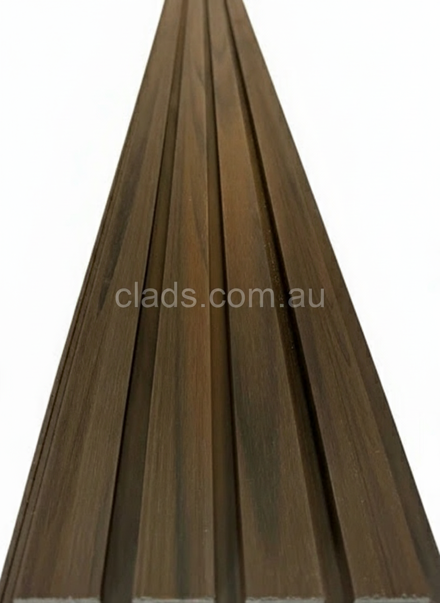 External walnut cladding with four slats, 5.8 meters long, from Clads Australia, showcasing the textured wood finish.
