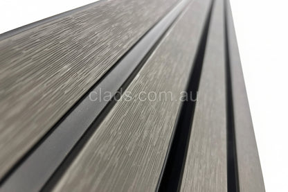 External half cladding in charcoal grey with four slats, installed on a building exterior, by Cladding Supplies of Australia.