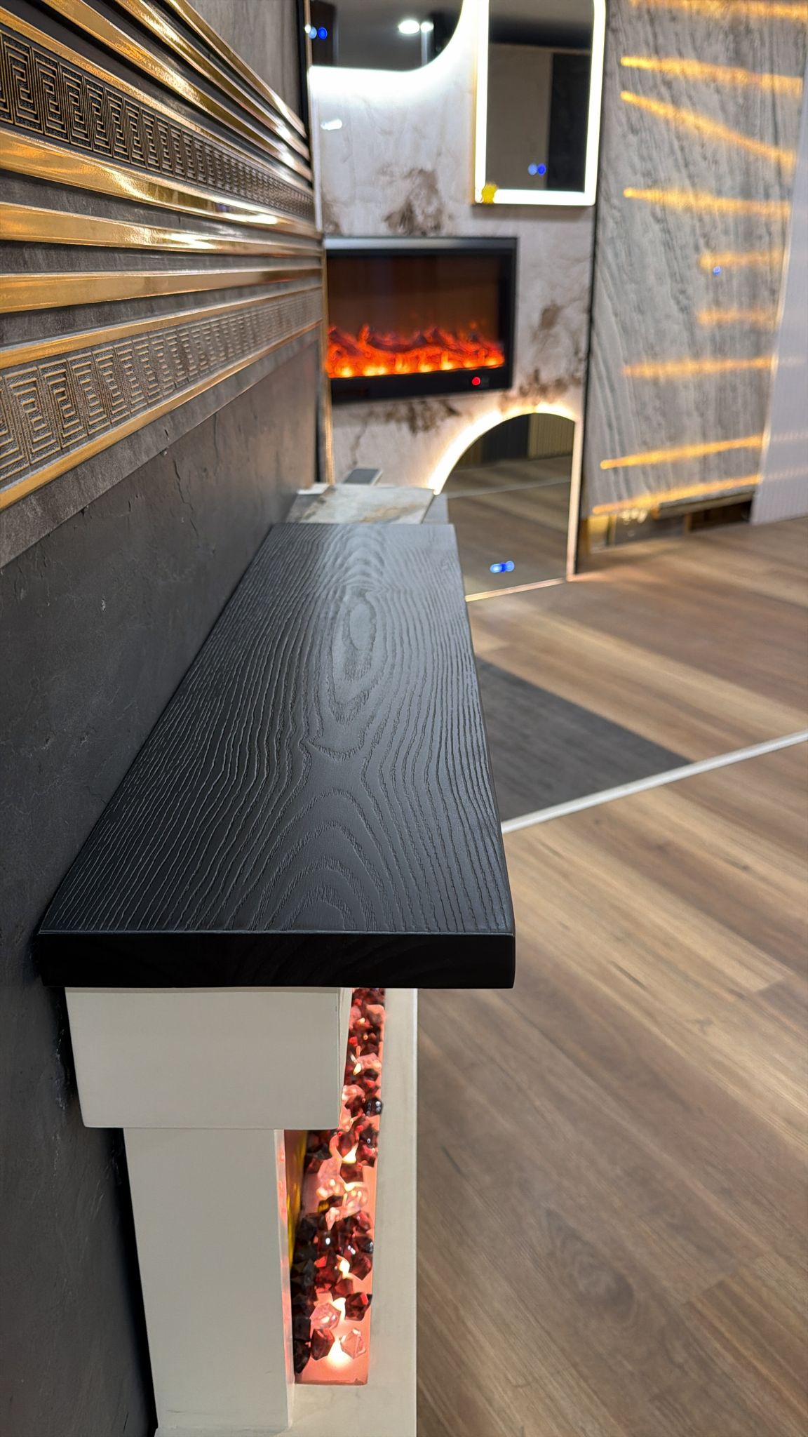 Black wooden floating shelves from Cladding Supplies of Australia, showcasing sleek, modern wall-mounted storage with visible wood grain.
