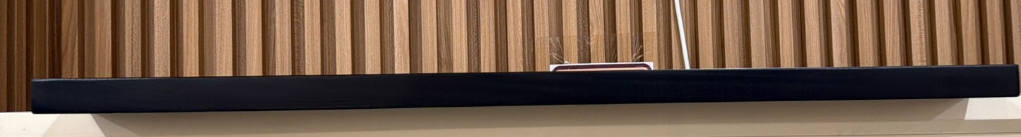 Black wooden floating shelves from Cladding Supplies of Australia, showcasing sleek, modern wall-mounted storage solutions.