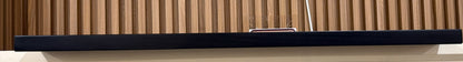 Black wooden floating shelves from Cladding Supplies of Australia, showcasing sleek, modern wall-mounted storage solutions.