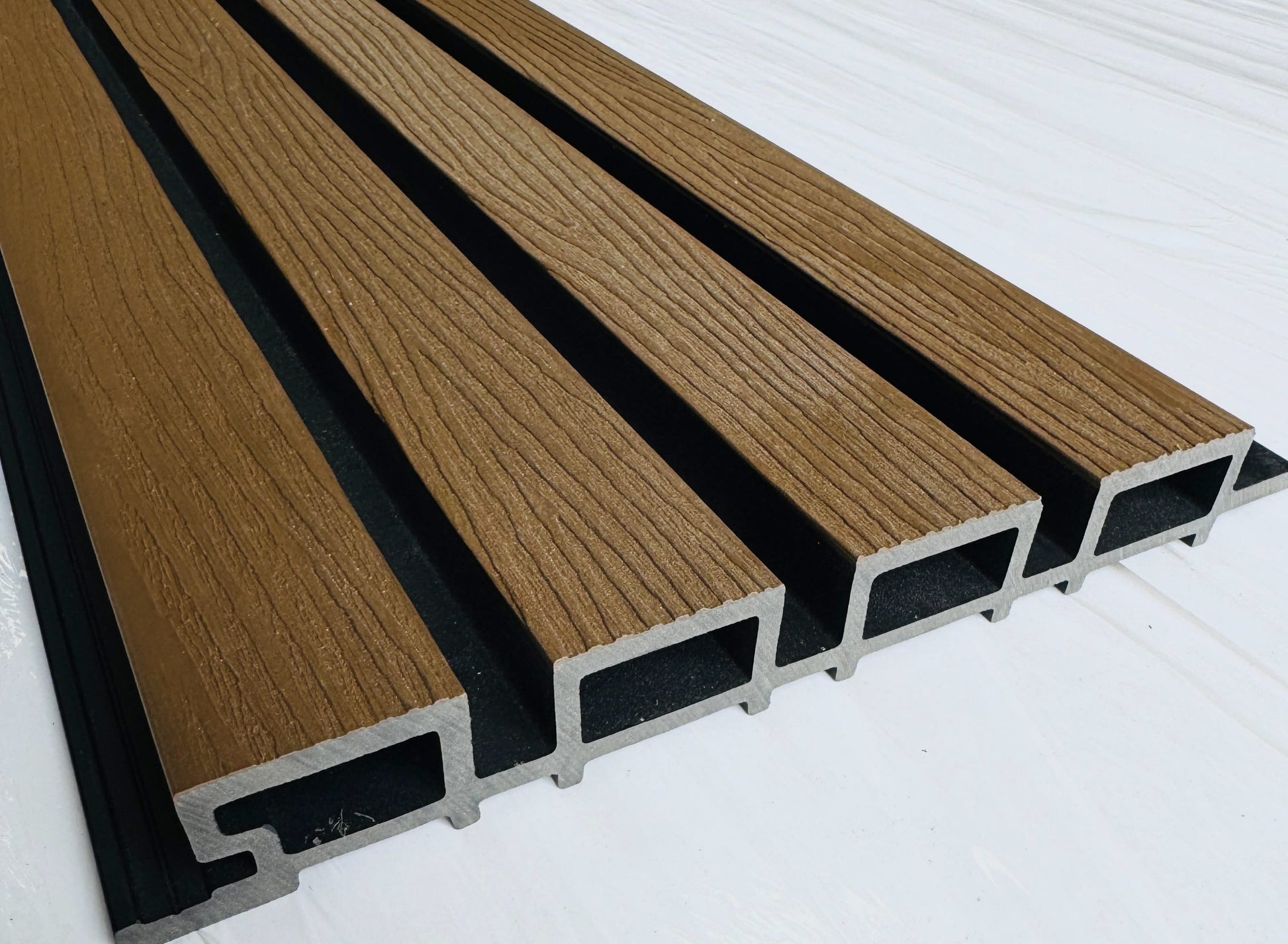External Ipe wood pattern half cladding with four slats, 5.8 meters long, by Cladding Supplies of Australia.