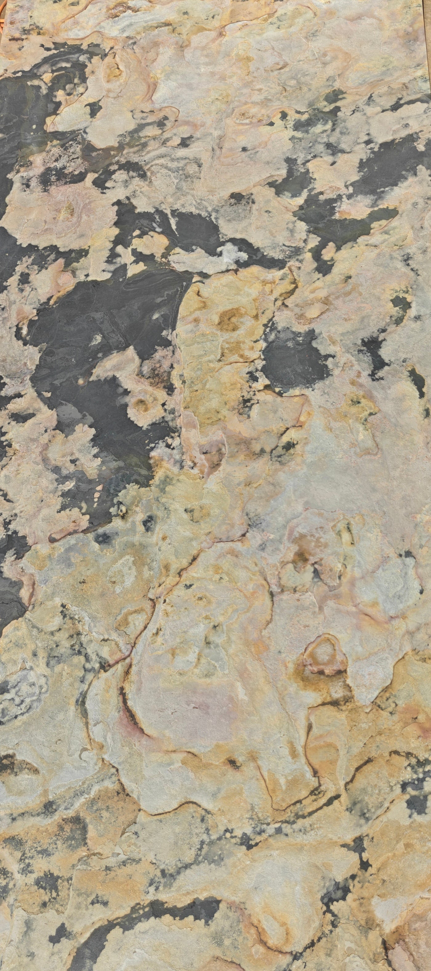Large T301 thin stone cladding from Clads Australia, showcasing the textured, natural stone surface in a close-up view.