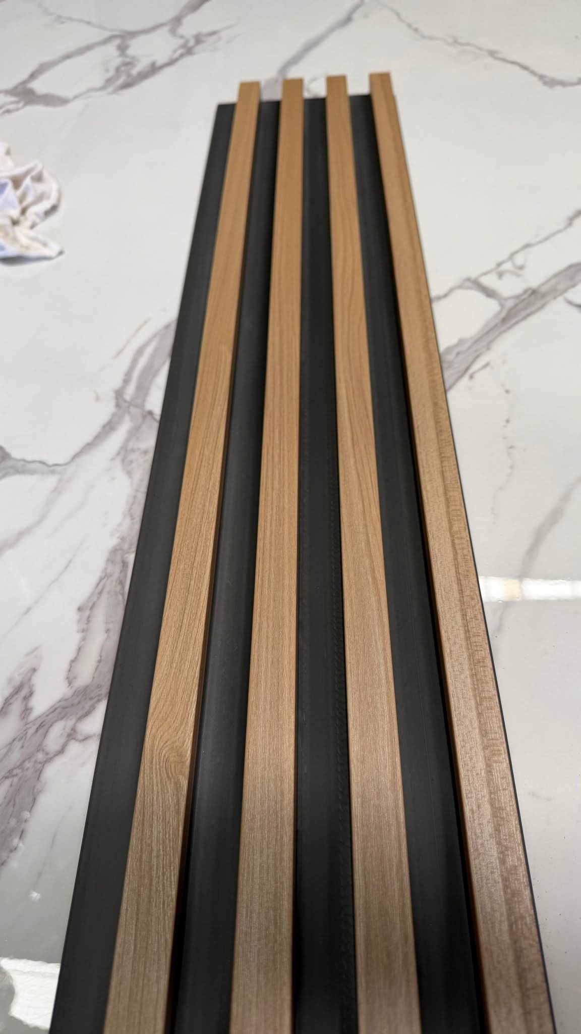 Internal teak half cladding with 4 slats, 3 meters long, from Cladding Supplies of Australia, showing the wood's natural finish and grain.