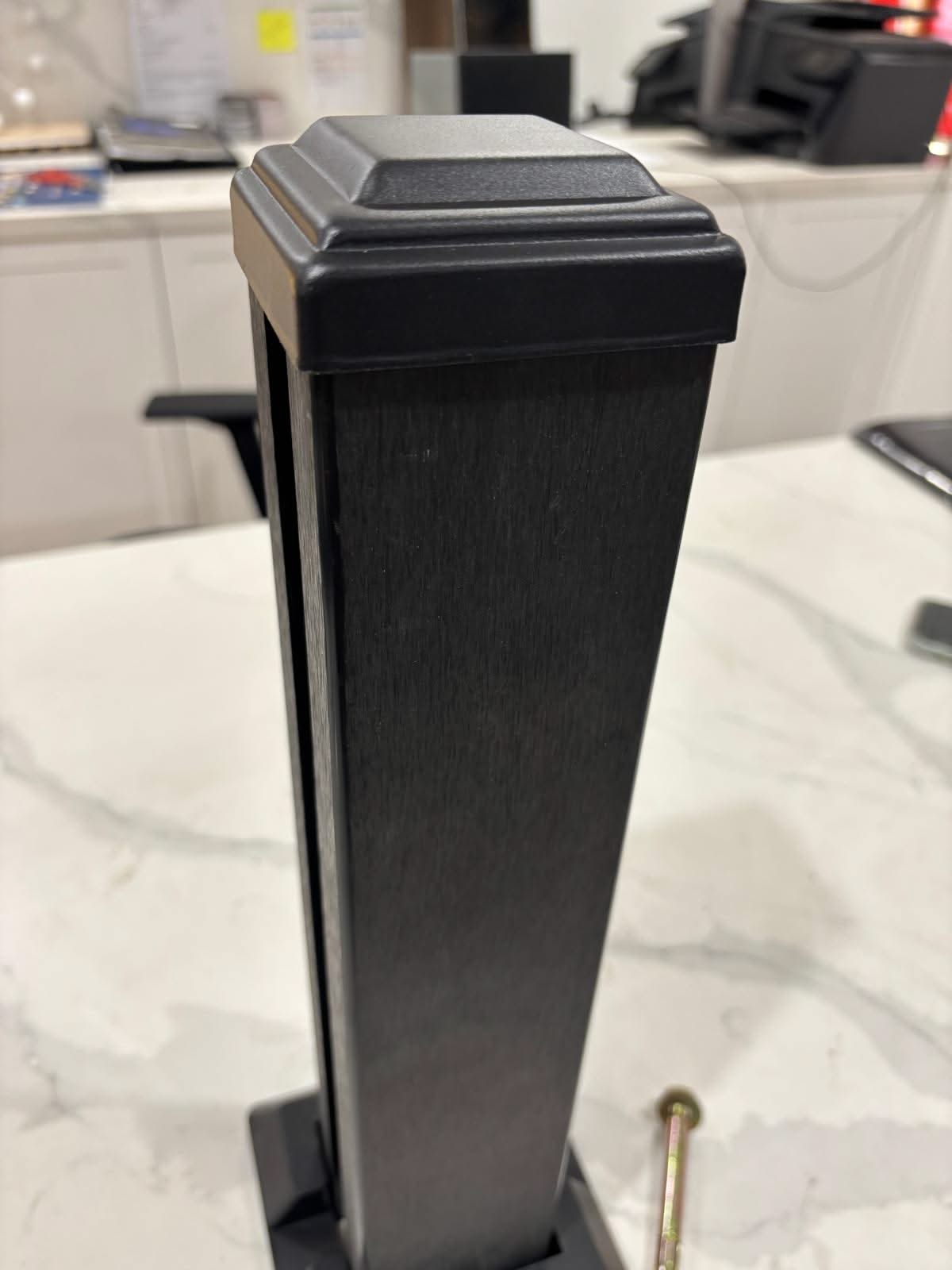 Horizontal WPC cladding post with accessories from Cladding Supplies of Australia, showcasing the textured wood-like finish.