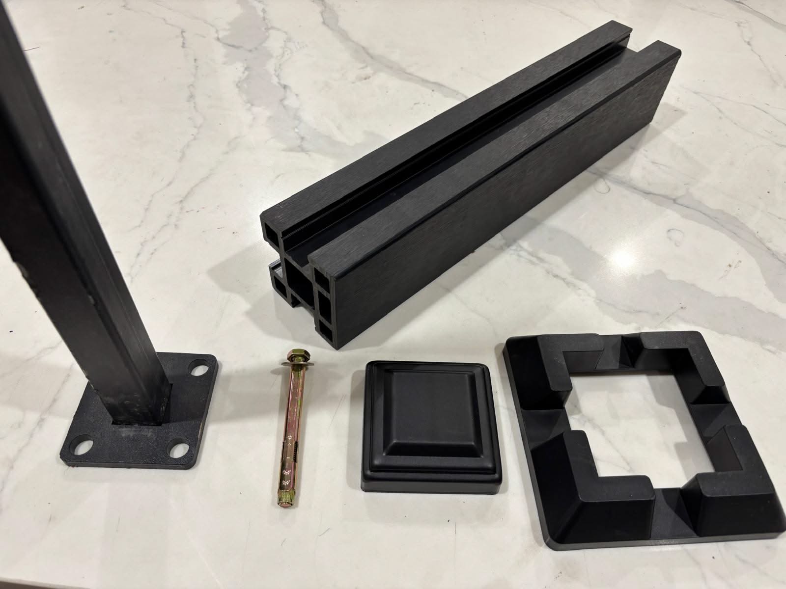 Horizontal WPC cladding post and accessories in natural wood finish, showcasing durable composite materials for exterior siding.