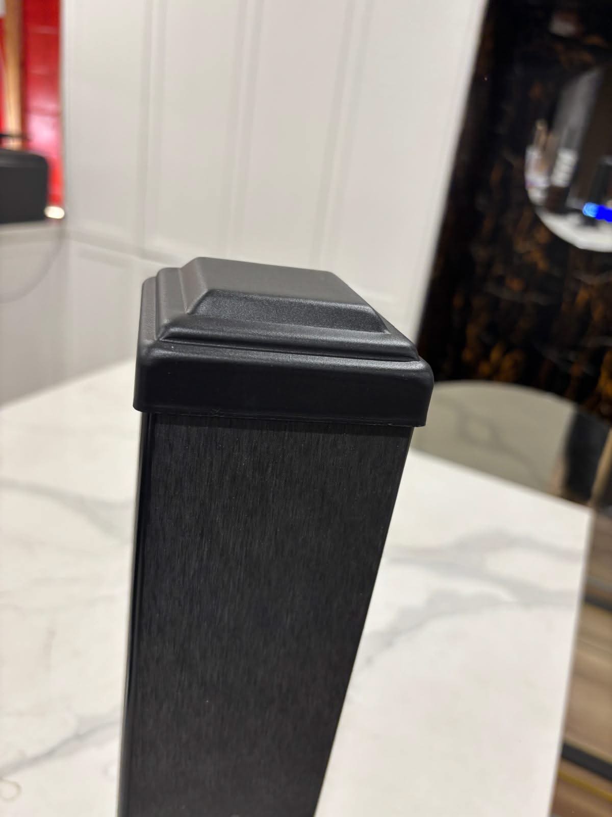 Horizontal WPC cladding post and accessories from Cladding Supplies of Australia, showing textured wood-like finish and fitting components.