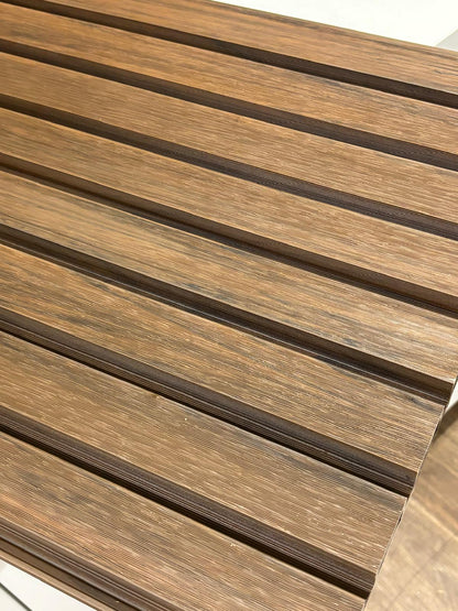 Walnut external cladding with four slats, showing natural wood grain and textured surface, by Clads Australia.