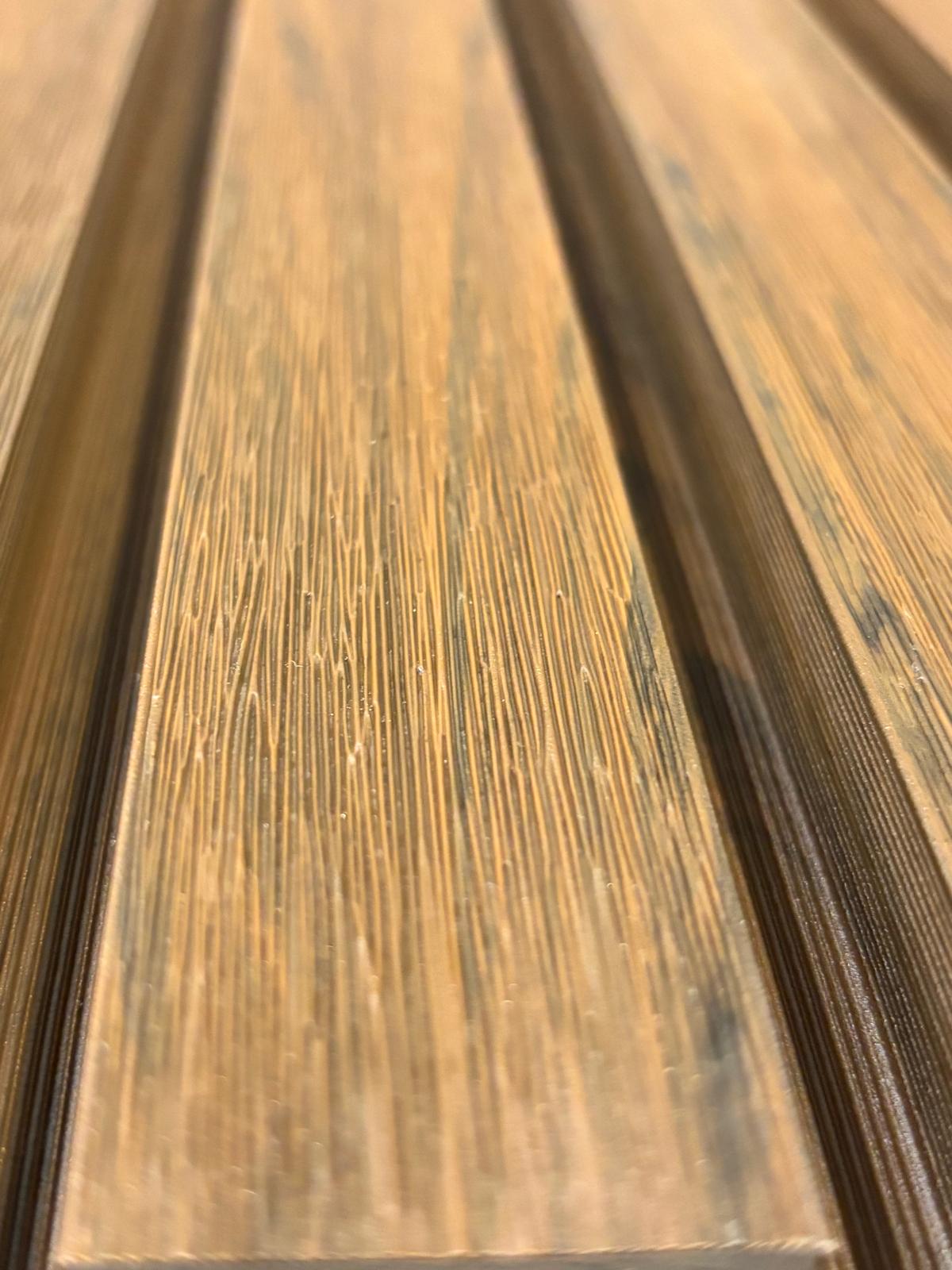 External walnut cladding with four slats from Clads Australia, showcasing natural wood grain and modern exterior wall design.