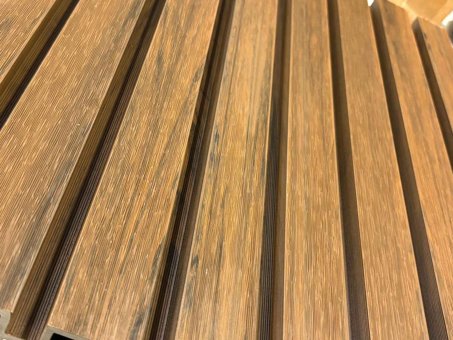 External walnut cladding with four slats from Clads Australia, showcasing rich wood grain and modern exterior design.