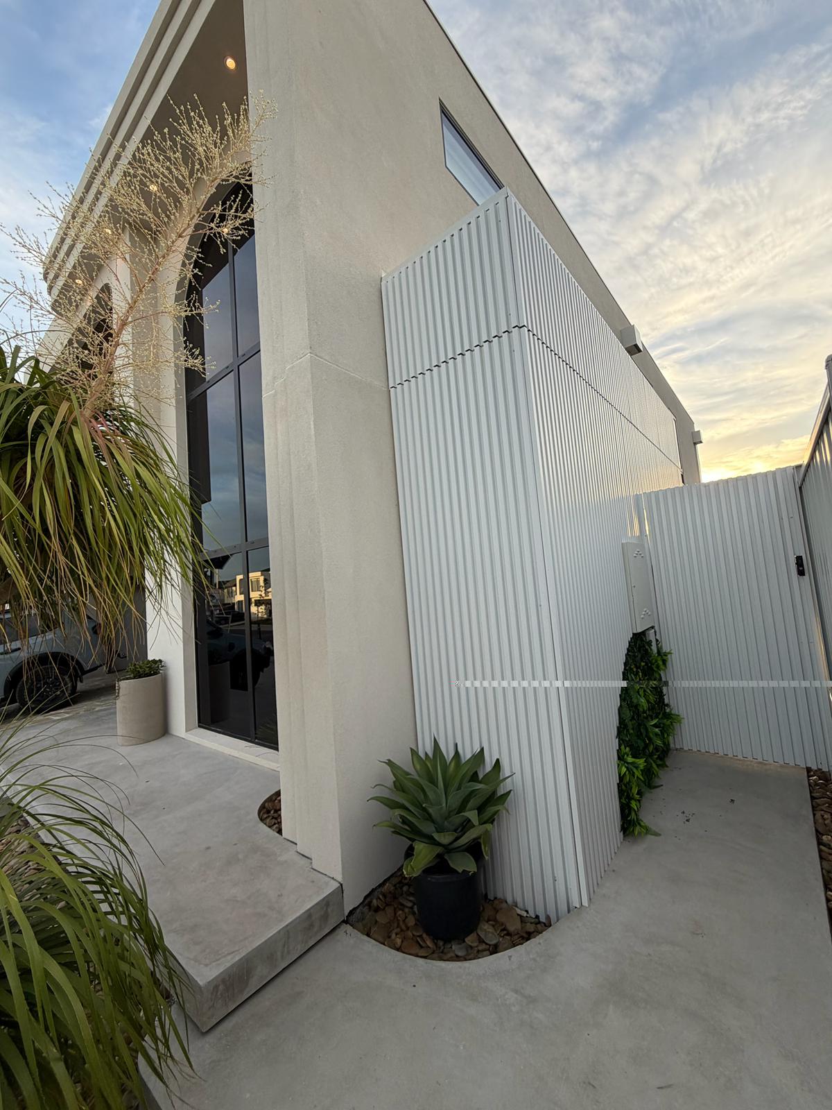 White aluminium exterior cladding panels from Clads.com.au, 3.2 meters long, ideal for modern building facades.